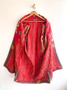 Fantastic traditional Turkmen robe/duster. Vivid colors and carefully embroidered workmanship. One of the best examples of this type of traditional wear we have come across. Infinitely wearable and looks great with jeans and boots. Add flair to a jeans and t uniform. Fabric: cotton/silk/ otherFit: S/MEra: 1940's Measurements: Bust 48" Sleeve (from collar) 32" Length 43" Waist 48" Hips 52" Condition: Excellent Traditional Long Red Outerwear, Red Embroidered Long Outerwear, Red Long Embroidered Outerwear, Long Red Embroidered Outerwear, Red Long Festive Outerwear, Festive Red Long Outerwear, Festive Long Red Outerwear, Red Long Cotton Outerwear, Long Red Cotton Outerwear