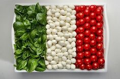 an italian flag platter with tomatoes, basil and mozzarella