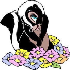 an image of a black and white animal with flowers around it's neck, sitting on the ground