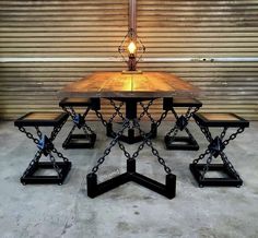 a table with four benches and a lamp on it in front of a garage door