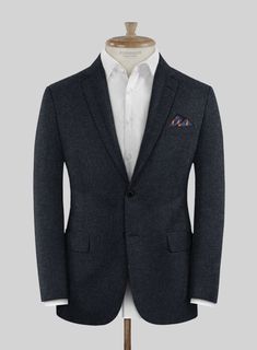 Attain a fashion-forward and contemporary flair with our Loro Piana Adriana Wool Suit. Meticulously crafted from pure wool fabric, this suit boasts a solid pattern in a captivating shade of blue infused with subtle black accents, providing a stunning enhancement to your overall look and imbuing a touch of luxury while ensuring exceptional comfort throughout the day. Whether it's a casual dinner or a high-stakes professional meeting, this suit unquestionably stands as the optimal choice, guarante Luxury Blue Tweed Jacket For Business Casual, Elegant Blue Tweed Jacket For Winter, Luxury Tailored Blue Tweed Jacket, Blue Wool Blazer With Suit Collar, Blue Wool Blazer For Business Casual, Blue Wool Blazer For Tailoring, Luxury Blue Suits For Winter, Elegant Winter Suits In Suiting Fabric, Wool Suits With Notch Lapel