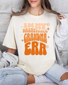 "About our Comfort Colors Basketball grandma sweatshirt basketball grandma shirt in my grandma basketball era sports grandma basketball grammy basketball gift idea 👉 Unisex T-shirt Comfort Colors introduces its garment-dyed t-shirt; a fully customizable tee made 100% with ring-spun cotton. The soft-washed, garment-dyed fabric brings extra coziness to your wardrobe while the relaxed fit makes it an excellent daily choice. The double-needle stitching throughout the tee makes it highly durable whi Grandma Sweatshirt, Married Shirt, Mrs Shirt, Honeymoon Shirts, Anniversary Shirt, Grandma Shirt, Basketball Gifts, Gardening Shirts, Grandma Shirts