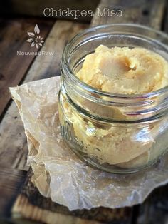 a jar filled with food sitting on top of a wooden table