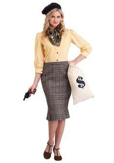 a woman in a skirt and shirt holding a bag