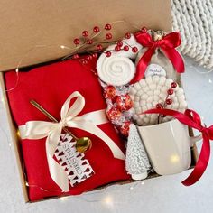 a red box filled with assorted items on top of a table