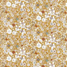 an orange and white floral pattern with many small flowers on the bottom half of it