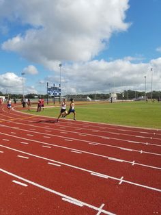 some people are running on a red track