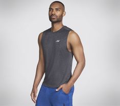 Stay dry and comfortable in bicep-friendly style wearing Skechers GO DRI Charge Muscle Tank. This sleeveless muscle tank features our soft moisture-wicking and quick-drying GO DRI fabric. | Skechers Men's GO DRI Charge Muscle Tank Top | GO DRI ALL DAY fabric is a lightweight performance jersey that has active stretch, quick dry technology and breathability to keep you cool and comfortable all day long | Sleeveless crewneck silhouette | Active Fit | 100% Polyester | Reflective Skechers logo detail at the nape Gray Sleeveless Go-dry Activewear, Athletic Heather Sleeveless Tank Top For Sports, Moisture-wicking Sleeveless Muscle Tee For Running, Sleeveless Activewear For Training In Athletic Heather, Functional Sleeveless Activewear In Athletic Heather, Athletic Fit Go-dry Muscle Tee For Sports, Athletic Fit Muscle Tee With Go-dry For Sports, Go-dry Tank Muscle Tee For Sports, Sporty Go-dry Muscle Tee