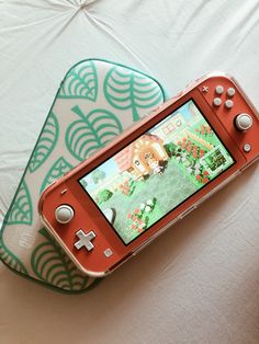 a nintendo wii game system sitting on top of a white tablecloth covered table cloth