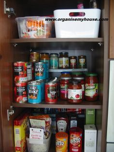 an organized pantry with canned food and other items