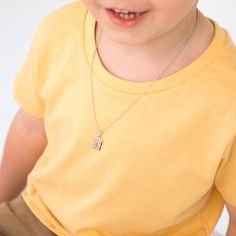 Discover a lovely first jewelry gift for your cherished young boy. This adorable Christian medal pendant necklace is impeccably crafted from 925 sterling silver, making it a perfect choice when shopping for Catholic gifts for children and preteens. It's a meaningful way to instill the importance of keeping faith close to the heart. The necklace comes complete with a chain, all neatly presented in a gift box, ready to make a memorable and thoughtful present. Age Group: Elegant for Children, Young Father's Day Gift Pendant Charm Necklace, Initial Pendant Necklaces With Charms For Birthday, Birthday Charms Necklace With Initial Pendant, Initial Pendant Necklace With Charms For Birthday, Silver Hypoallergenic Necklace For Father's Day, Birthday Initial Pendant Necklace With Charms, Sterling Silver Birthstone Necklace With Rectangular Pendant, Father's Day Jewelry Charms For Gifts, Father's Day Gift Charms Jewelry