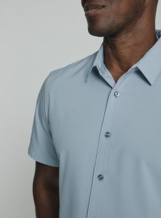 We created the perfect short sleeve button up, with the right mixture of comfort and style, just for you. Our performance shirts have 4-way stretch, are moisture wicking, wrinkle resistant and above all a great new addition to your wardrobe. The performance shirt will be your go-to for any occasion - day to night. This is a shirt that will have you satisfied at any given time. Details Model is 6'1" and wears a size medium. Care: Machine wash cold on delicate cycle, low tumble dry, do not iron Co Short Sleeve Business Casual Shirt, Solid Color Short Sleeve Shirt For Business Casual, Solid Short Sleeve Shirt For Business Casual, Blue 4-way Stretch Short Sleeve Tops, Blue Short Sleeve Top With 4-way Stretch, Classic Solid Short Sleeve Shirt For Business Casual, Modern Semi-formal Short Sleeve Shirt, Modern Short Sleeve Shirt For Formal Occasions, Light Blue Short Sleeve Shirt For Formal Occasions