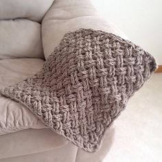 a crocheted blanket on the back of a couch