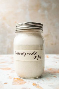 a jar with a label on it that says hemp milk 2 / 4