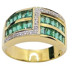 Emerald 1.17 carats with Diamond 0.14 carat Ring set in 18 Karat Gold Settings Width: 1.8 cm Length: 1.0 cm Ring Size: 53 Total Weight: 8.29 grams "We first opened doors in 1980 when it was then situated in the vicinity of the Victory Monument; a small and modest storefront with a couple of counters. From its humble beginnings to where it stands today, our company has proven its abilities as a jeweler. Since the beginning, we have been supplying fine quality pieces to dealers, wholesalers and cu Luxury Channel Set Emerald Ring For Anniversary, Luxury Green Channel Set Rings, Luxury Emerald Ring With Diamond Channel Set, Luxury Emerald Rings Channel Set, Luxury Emerald Rings With Channel Set, Luxury Emerald Diamond Ring With Channel Set, Formal Emerald Diamond Ring Channel Set, Luxury Channel Set Emerald Ring For Formal Occasions, Luxury Formal Emerald Ring With Channel Set