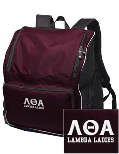 a maroon backpack with white letters on the front and side, sitting next to a black bag