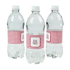 three bottled water bottles with labels on them