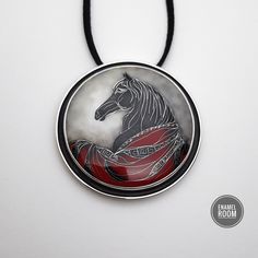 Elevate your outfit with this elegant horse jewelry that exudes charm and sophistication. This unique brooch/pendant combines stunning cloisonné enamel artistry with the timeless beauty of sterling silver. Handcrafted with care and attention to detail, this piece is sure to become a cherished addition to your collection. Make a statement with this distinctive jewelry that captures the grace and majesty of the horse. The author of this piece of jewelry-Enamel jewelry artist Maka Gurashvili/Design Silver Medallion Brooches As A Gift, Medallion Necklace With Brooch As Gift, Elegant Enamel Necklaces With Polished Finish, Silver Brooch With Large Pendant As Gift, Elegant Round Jewelry With Horse Design, Formal Black Enamel Pendant Necklace, Elegant Black Enamel Necklace, Formal Silver Jewelry With Horse Design, Collectible Enamel Pendant Jewelry