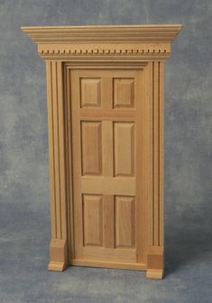 an unfinished wooden door on a gray background