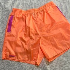 Vintage Columbia Neon Shorts In Brand New Condition. They Are 100% Nylon And Some What See Through. Summer Pink Nylon Bottoms, Casual Pink Nylon Shorts, Orange Nylon Beachwear Bottoms, Spring Nylon Stretch Swim Trunks, Casual Orange Nylon Shorts, Summer Nylon Short Bottoms, 90s Beach Style Bottoms For Spring, Pink Nylon Summer Shorts, Casual Nylon Athletic Shorts For Spring