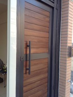 a close up of a wooden door on a building