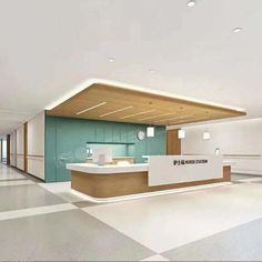 an empty office lobby with white and wood accents on the walls, flooring and counter tops