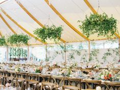 a large tent with tables and chairs set up for an event