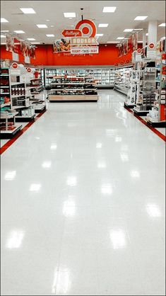 an empty grocery store aisle with no customers