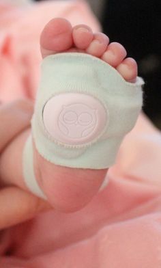 a baby's foot with a bandage around it