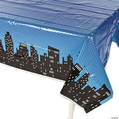 a blue table cloth with black and white cityscape on it