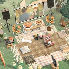 an aerial view of a picnic with food on the table and people watching television in the background