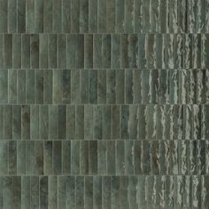 an image of a green tile wall that looks like it is made out of stone