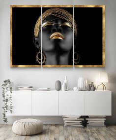 a woman's face in gold and black