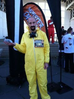 a man in a yellow suit and gas mask