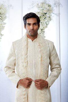 This sherwani set features appliques in soft lemons and pinks. It is paired with an off-white silk kurta and cotton a silk afghani salwar. Complimenting stole and footwear is also available.From Seema Gujral's Tuscan Summer collection. DELIVERY TIMEPlease allow 8-12 weeks for your outfit to arrive.FABRIC DETAILSNetProfessional cleaning only. Festive Off-white Dupatta With Naqshi Detailing, Festive Off White Dupatta With Naqshi Detail, Festive Off-white Dupatta With Naqshi, Festive Off White Dupatta With Naqshi, Cream Sherwani With Chikankari Embroidery For Festivals, Cream Naqshi Bandhgala For Festivals, Cream Sherwani With Dupatta For Festivals, Designer Off White Festive Sets, Cream Bandhgala With Dupatta For Festivals