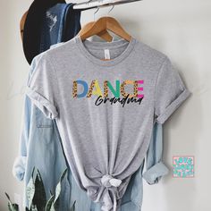 Dance Grandma Shirt Dance Grandma T-Shirt Gift for Grandma Dancing Shirts Dance Class Support Tshirt Toddler Dance Mom Teacher Get ready, this shirt is about to become your favorite! Made of super soft cotton with a comfy fit, you'll find it fits in with all your outfits! The details: Super Soft Pre-shrunk Cotton Tee Unisex - Fits true to size (see size chart for reference) Printed with DTG - Direct to Garment Printing - which is different than vinyl heat press. With DTG, the image is transferre Custom Baseball Shirt, Toddler Dance, Cheer Shirt, Auntie Shirts, Graduation Shirt, Pom Pom Girl, Boss Shirts, Cheer Shirts, Senior Gifts