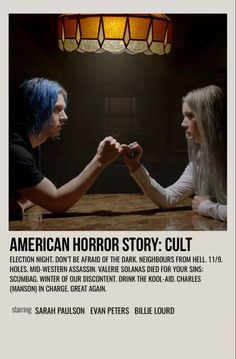 an advertisement for the american horror story cult, featuring two people sitting at a table