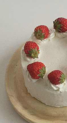 there is a cake with strawberries on it