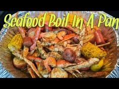 seafood boil in a pan with corn and potatoes