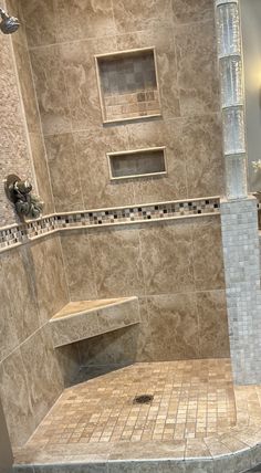 a walk in shower sitting inside of a bathroom