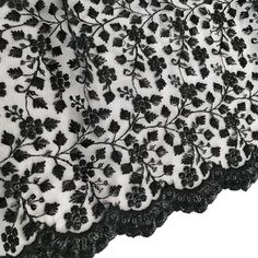 black and white lace with flowers on it