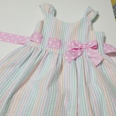 Seersucker Dress With Back Zip Lined Cute Seersucker Dresses With Ruffles, Cute Ruffled Seersucker Dresses, Cute Seersucker Dresses For Spring, Cute Seersucker Spring Dresses, Cute Gingham Seersucker Dresses, Cute Striped Cotton Dress, Playful Pastel Dresses With Ruffles, Striped Seersucker Dresses With Ruffles, Cute White Seersucker Dress