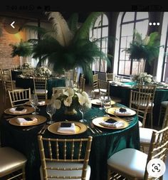 the table is set with gold and green linens