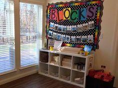 there is a colorful bulletin board in the corner of this room