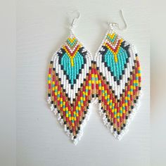 Beautiful One Of A Kind Detailed Beaded Earrings. Southwestern/Native Style. Great For Festivals! These Were Traditionally Made In A Village In Ecuador. Southwestern Style White Earrings For Festivals, White Southwestern Beaded Earrings For Festivals, Southwestern White Beaded Earrings For Festival, White Southwestern Style Beaded Earrings For Festival, Southwestern Round Beads Earrings For Beach, Southwestern Handmade Earrings For Beach, Southwestern Multicolor Teardrop Earrings, Handmade Southwestern Beaded Earrings For Beach, Adjustable Southwestern Beaded Earrings For Beach