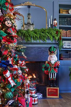 a decorated christmas tree in front of a fireplace