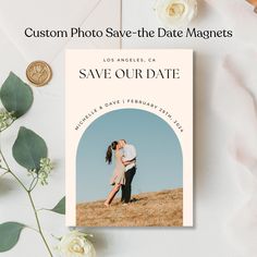 a photo save - the - date magnet is shown next to some flowers