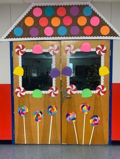 a door decorated to look like a candy shop with lollipops on it