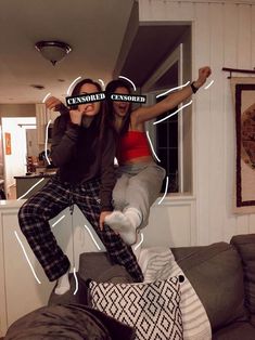 two people are jumping in the air with their hands on their hipss and one person is holding up a pair of glasses