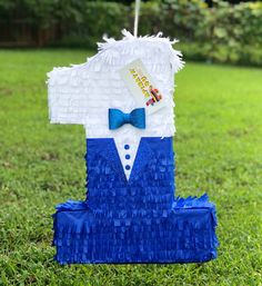 a blue and white pinata with a bow tie on it's lapel